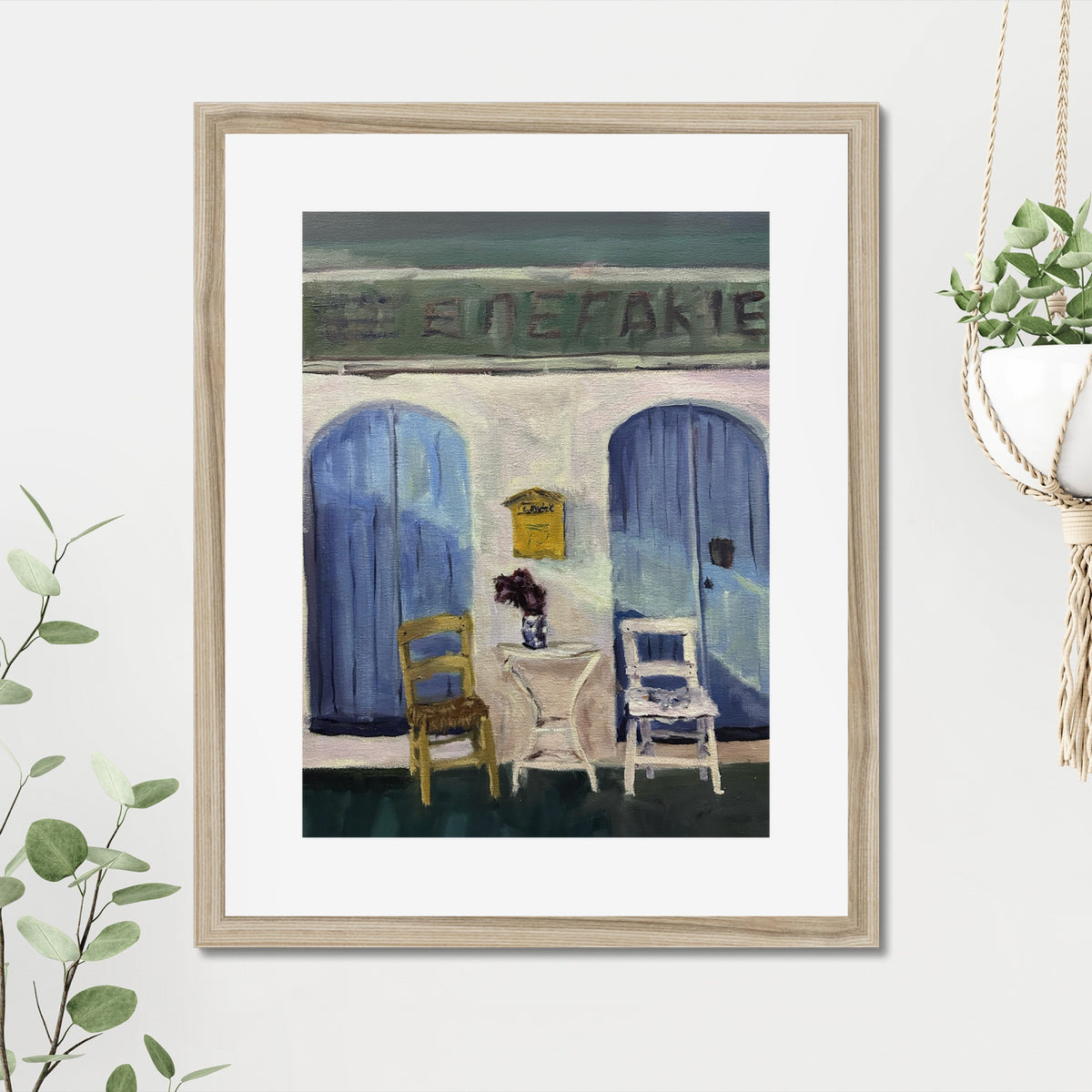 Empty Chairs art print, 16x20, in a natural frame with white mat, hanging on a wall