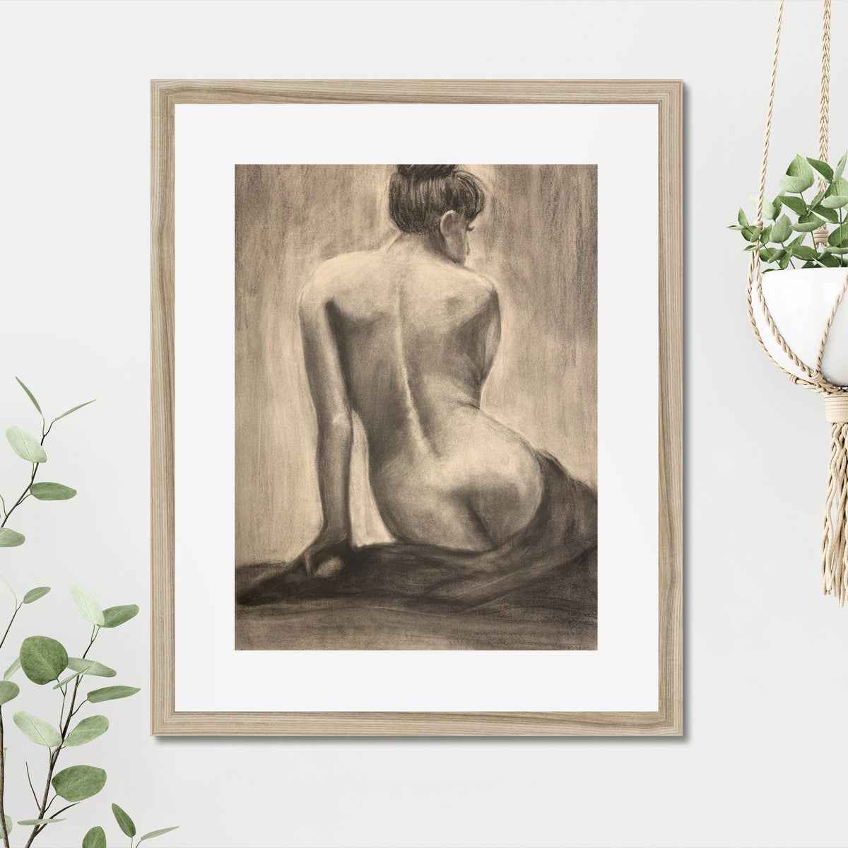 Seated Figure Study art print, 16x20, in a natural frame with white mat, hanging on a wall