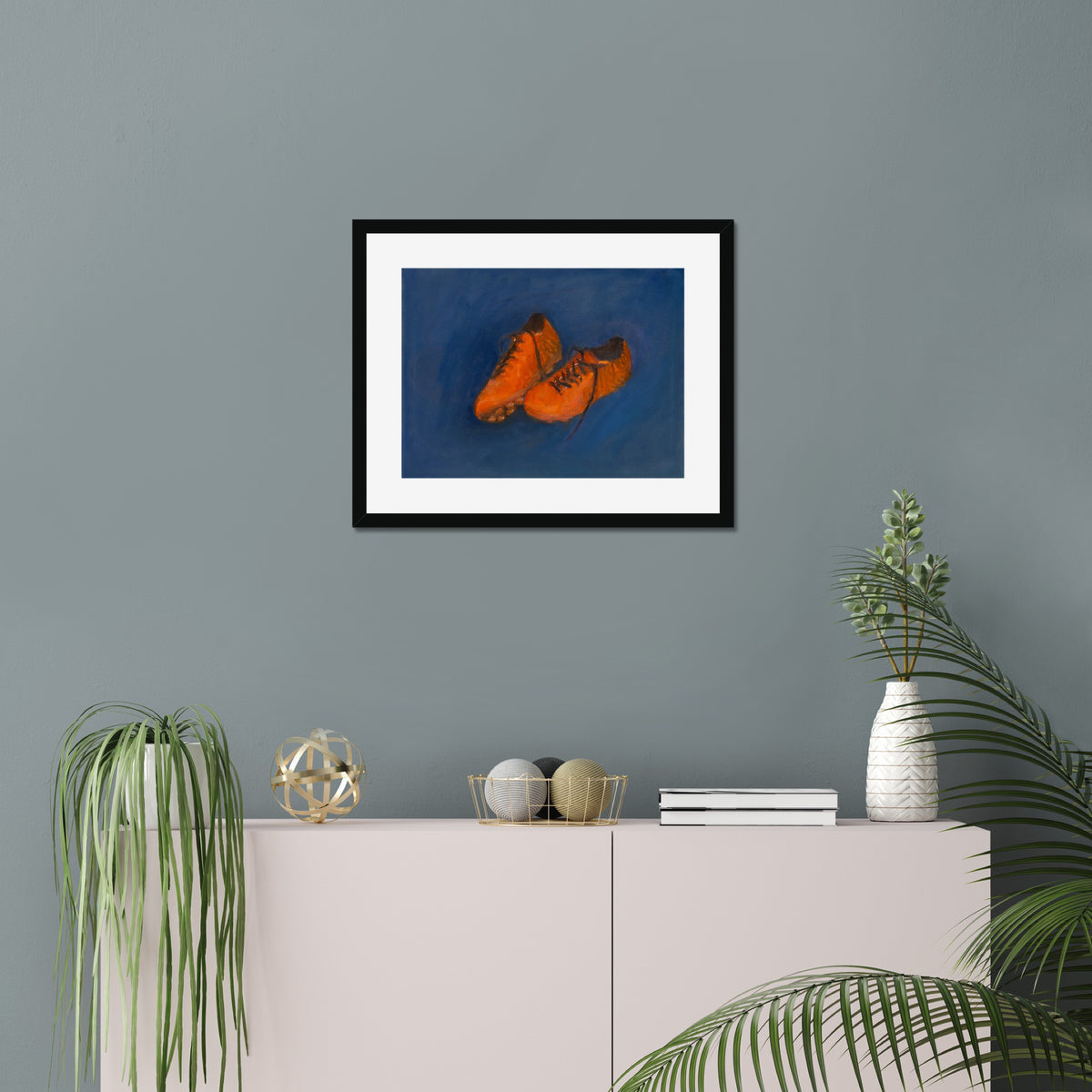 Soccer Shoes art print, 16x20, in a black frame with white mat, hanging on a wall
