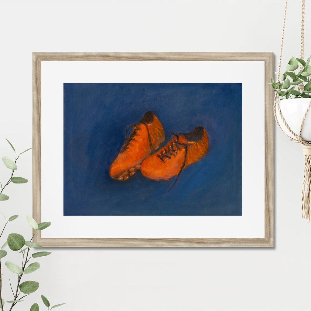 Soccer Shoes art print, 16x20, in a natural frame with white mat, hanging on a wall