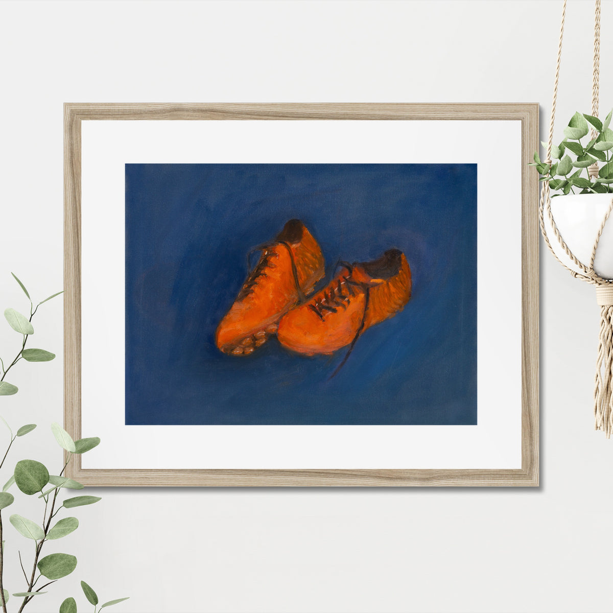 Soccer Shoes art print, 16x20, in a natural frame with white mat, hanging on a wall